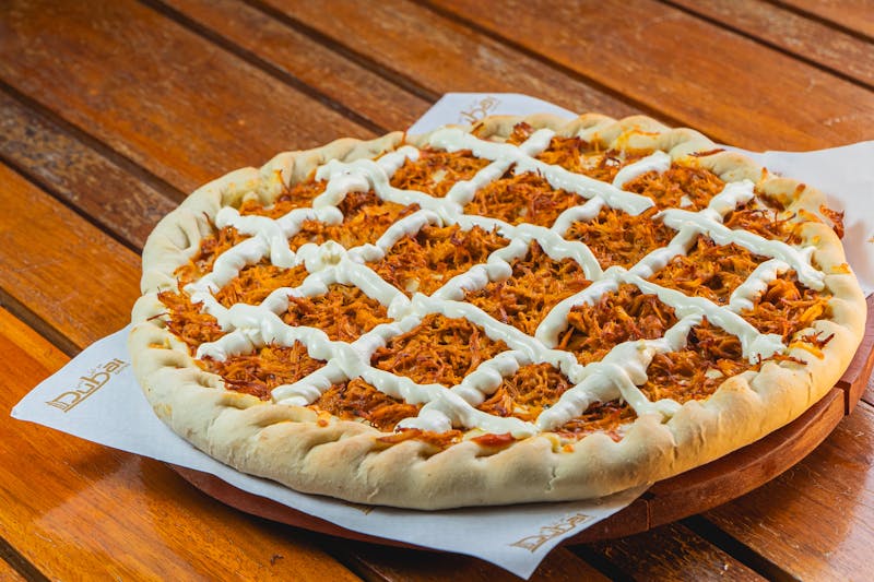BBQ chicken pizza with caramelized onions